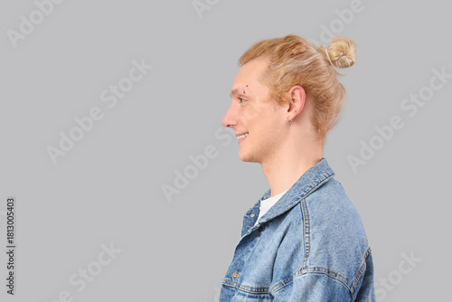Young blonde man in denim j...
