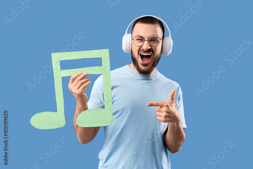 Singing young man in headph...