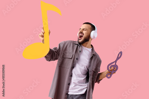 Singing young man in headph...