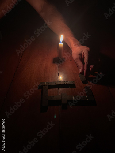 Dominoes by candlelight