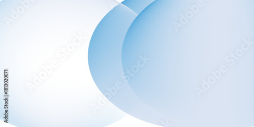 A soft blue background with overlapping translucent circles. The blue background has a smooth gradient texture, creating a calming effect. Gradient aesthetic. Blue background with copy space.