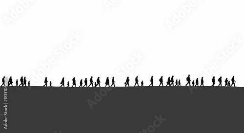 Silhouettes of a crowd of people walking in a line.