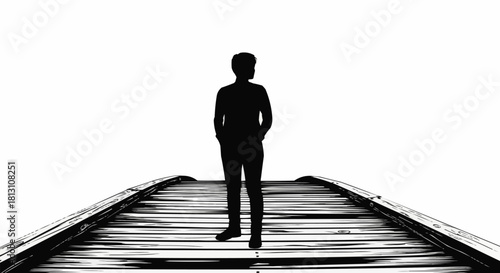 Silhouette of a man standing on a wooden bridge.