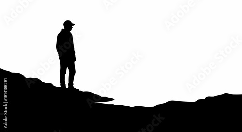 Silhouette of a Person Standing on a Hilltop.