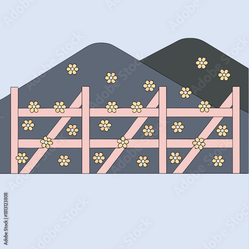 Pastel pink wooden fence with yellow flowers against dark hills