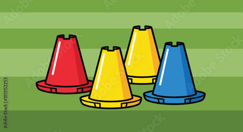 Colorful training cones for sports drills and athletic practice on a green striped field background