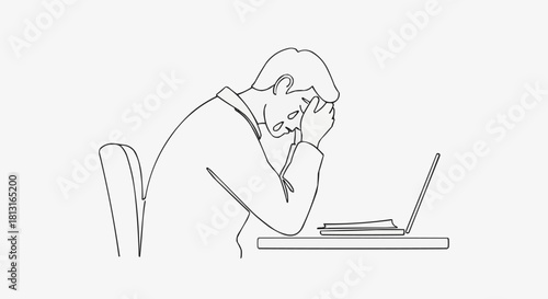 Man stressed at desk with laptop, hands on face, feeling overwhelmed.