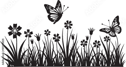Black silhouette of butterflies flying over grass and flowers