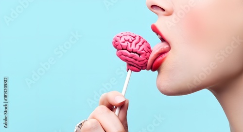 Wallpaper Mural Woman with red lipstick licking a pink brain-shaped lollipop, conceptual image on a blue background. Torontodigital.ca