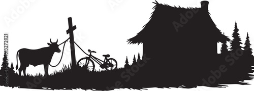 Black silhouette of cow tied to post near bicycle and thatched roof hut