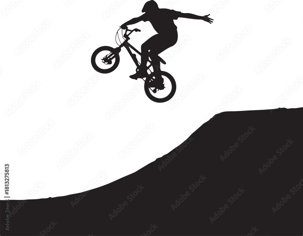 Fototapeta premium Silhouette of B M X rider performing a jump over a dirt ramp