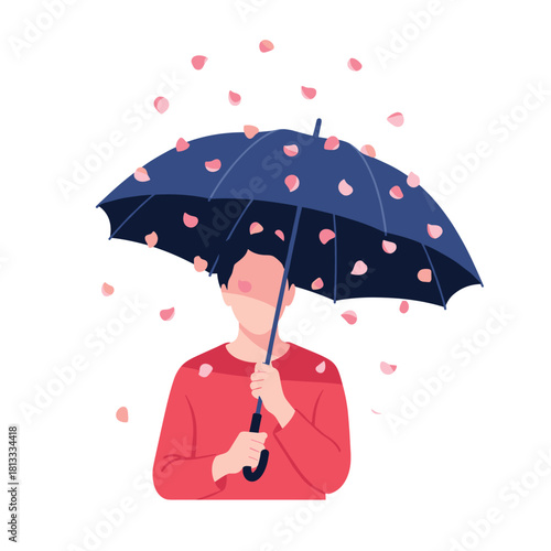 Person holding a large blue umbrella while a shower of delicate pink rose petals gently falls all around them.
