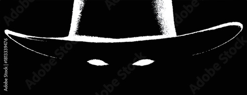 검은 배경에 모자를 쓴 미스터리한 인물의 빛나는 눈