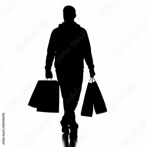 Black silhouette of a man walking forward carrying shopping bags.