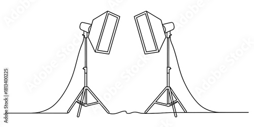 Continuous line drawing of two studio softbox lights on tripods, outlining professional photography equipment for creative projects and media production