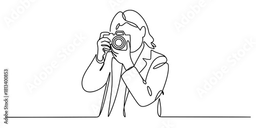 Continuous line drawing of a photographer with a camera, capturing a moment, representing creativity, visual storytelling, digital media, and modern art style.