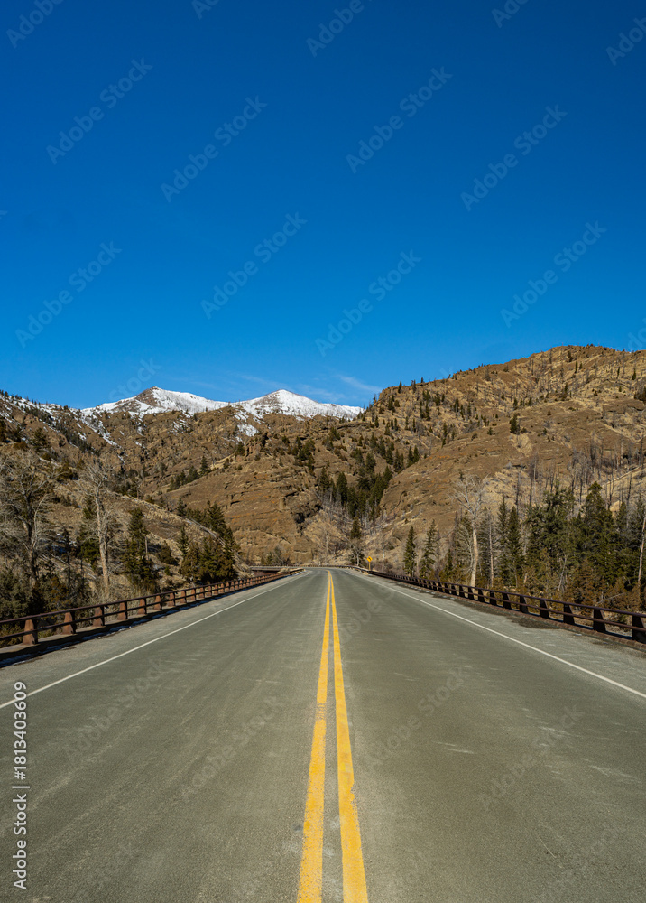 Fototapeta premium Long Road into Tall Mountains