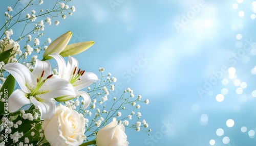 Beautiful white lilies and roses with baby's breath on a soft blue background