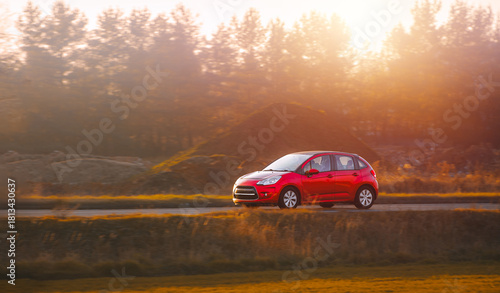 Fototapeta Naklejka Na Ścianę i Meble -  Motion blur effect on driving small car