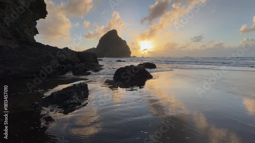 Sunset view at Piha Beach, Auckland, New Zealand.