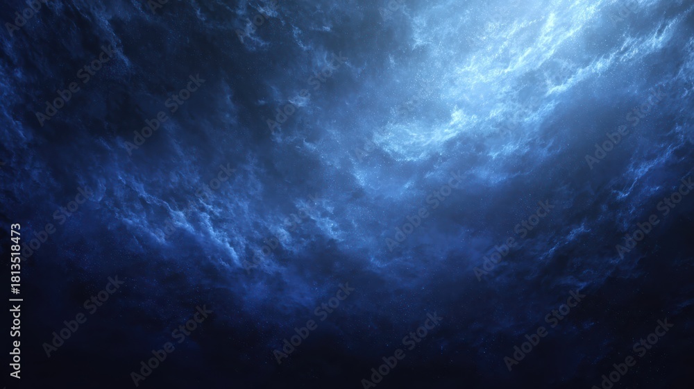 Fototapeta premium A mesmerizing deep blue ocean surface with dramatic lighting and texture.