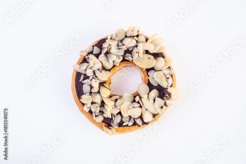 Chocolate garnish Donut. Frosted Chocolate Donut, Chocolate Drizzled Donut, Chocolates donut close-up on a white background.