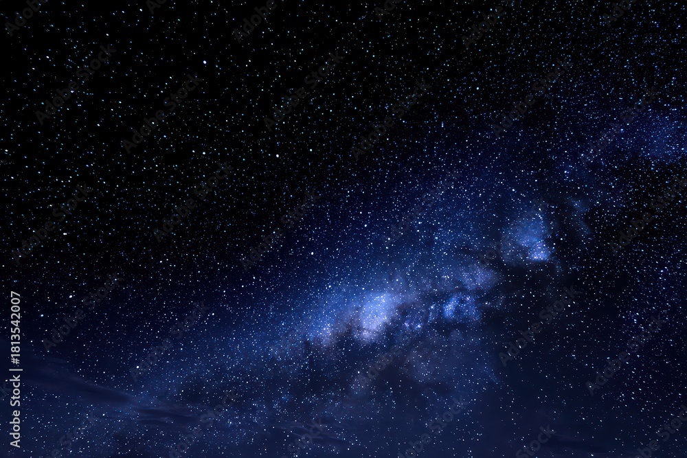 Fototapeta premium Dramatic Deep Blue Starry Night Sky with Milky Way Galaxy and Scattered White Stars in Celestial Space