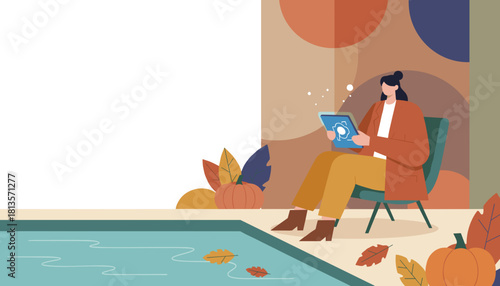 Woman working on a tablet in a cozy autumn scene with fall leaves and pumpkins