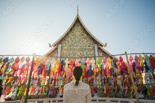Woman at the temple with paper lanterns, Wat Chedi Luang, Chiang Mai, Thailand
