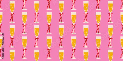 Festive champagne flutes with red ribbons on a pink background for celebrations or parties