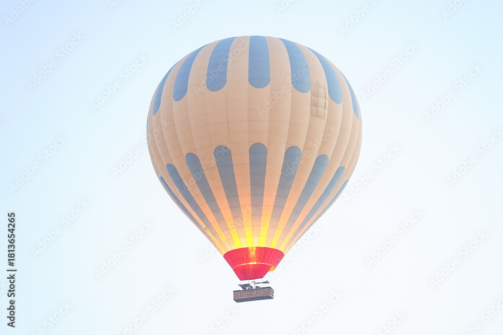 Fototapeta premium Hot Air Balloon over Cappadocia Valleys in Nevsehir, Turkiye