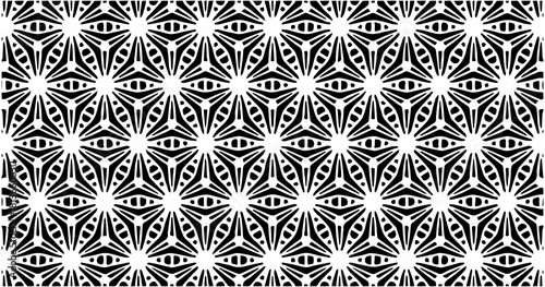 Intricate symmetrical geometric pattern with black and white intersecting shapes forming a seamless texture.