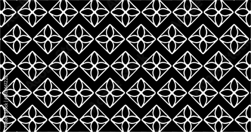 Diamond-based geometric pattern with symmetrical inner shapes in a repeating black and white layout.