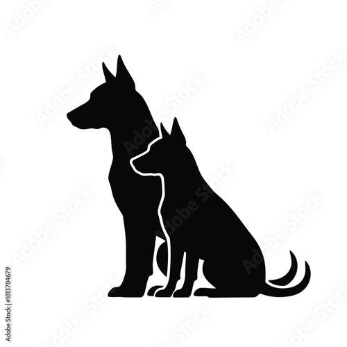 Silhouette of two dogs sitting together