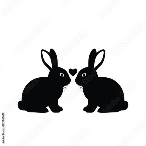 Two black rabbit silhouettes facing each other with heart