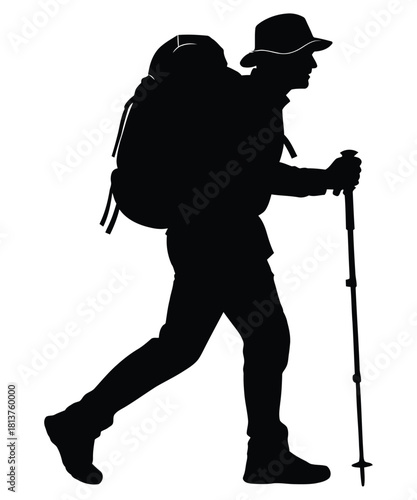 Silhouette of a hiker with a backpack and trekking pole