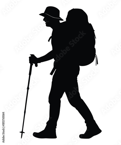 Silhouette of a hiker with backpack and trekking poles