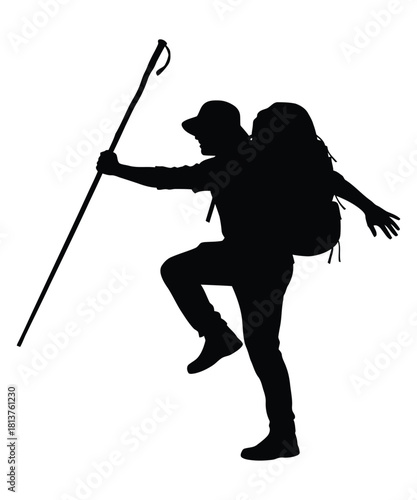 Silhouette of a hiker with a backpack and trekking pole