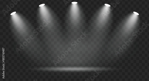 Five bright spotlight beams illuminating a dark stage or empty space with visible smoke or haze effect in the air