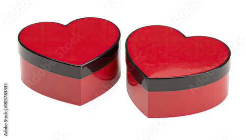 Two glossy red heart-shaped gift boxes with black rims on a black background