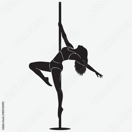 Silhouette of a woman performing a pole dance routine with graceful movements