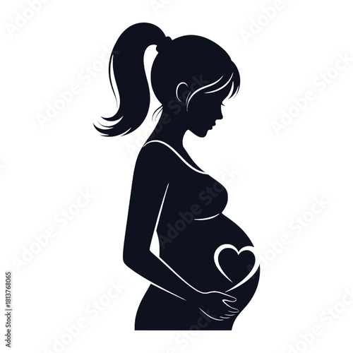 Silhouette of a pregnant woman holding a heart over her belly
