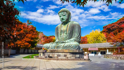 Fotografie Daibutsu or Great Buddha of Kamakura in Kotokuin Temple at Kanagawa Prefecture Japan with leaves changing color It is an important landmark and a popular destination for tourists and pilgrims