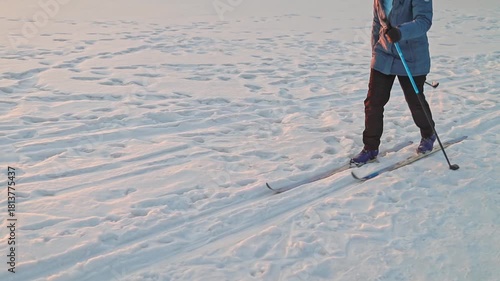 close-up of female skier legs, the importance of staying active and healthy outdoors. Concept: retirement communities, wellness centers, sports equipment.