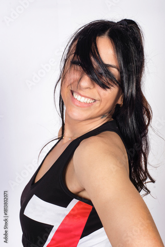 Smiling Young Woman Posing Playfully in Studio