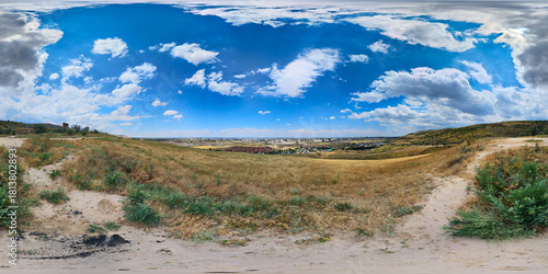 360 panorama of serene landscape with dry grass and distant city skyline, equirectangular projection