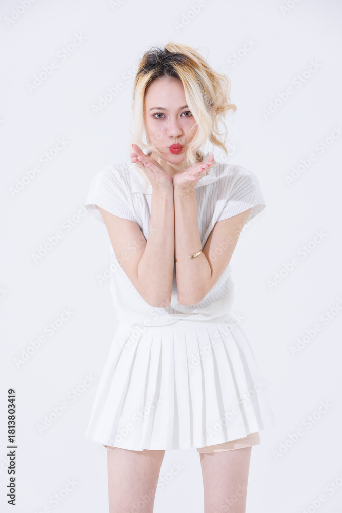 Naklejka premium Asian confident attractive beautiful young woman blonde hair tied stand wearing white shirt top mini skirt sport background studio, portrait lifestyle fashion outfit trendy style pose look at camera.