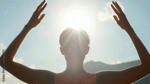 Wallpaper Mural Video A person stands looking up at the sun with their hands on their head, capturing a moment of awe and wonder Torontodigital.ca