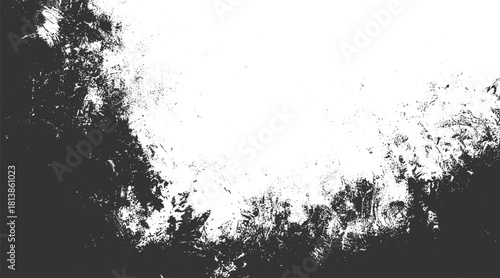 Dark grunge texture with white negative space and scattered speckles black