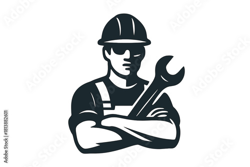Professional tradesman in safety gear holding a wrench with arms crossed